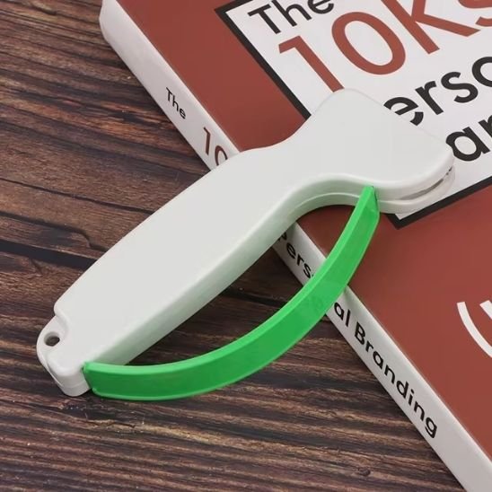 affuteur de couteau vert et blanc