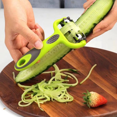 Eplucheur 3 en 1 vert coupe en spaghetti un concombre