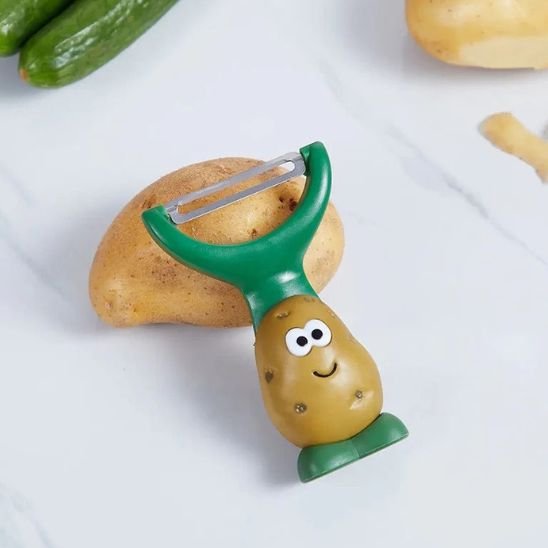 Eplucheur en forme de pomme de terre avec visage souriant